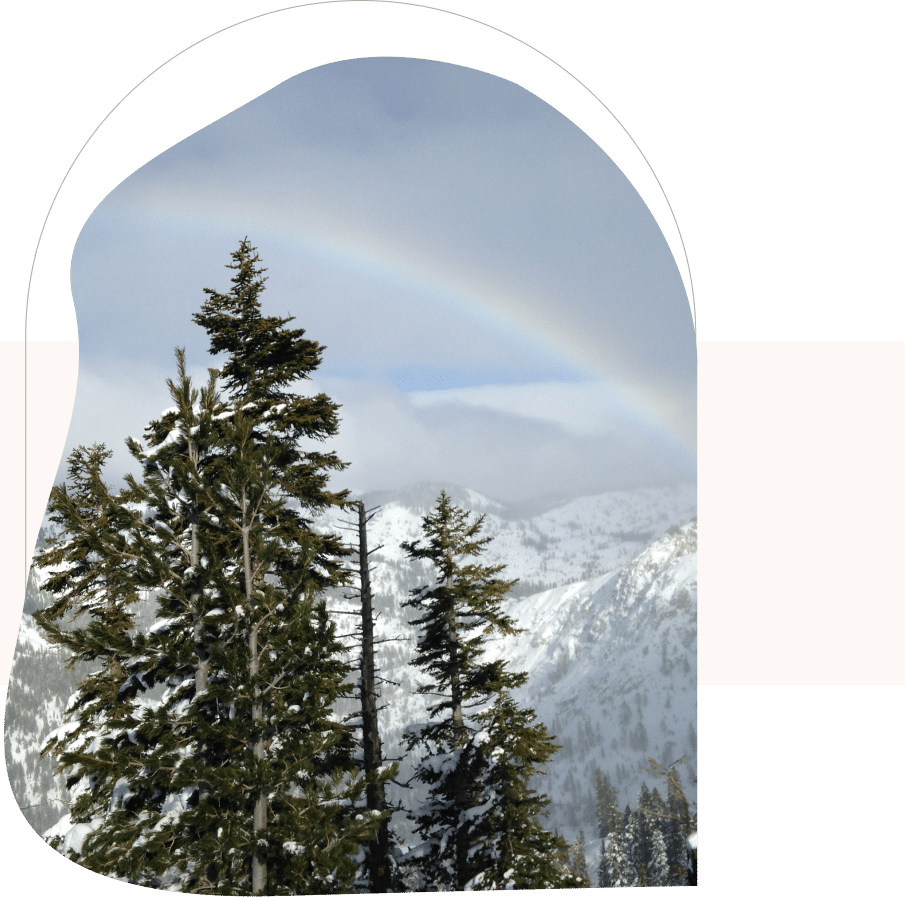 Snowy mountain and rainbow scene symbolizing hope and renewal with a CBT therapist in San Francisco.